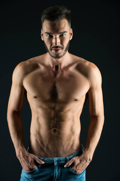 Sportsman. Sportsman with muscular torso. Strong sportsman with six pack and ab. Confident sportsman. Keep fit