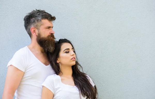 Youth stylish outfit. Couple friends hang out grey background copy space. Feel their style. Couple white shirts cuddle each other. Hipster bearded and stylish girl hang out urban romantic date
