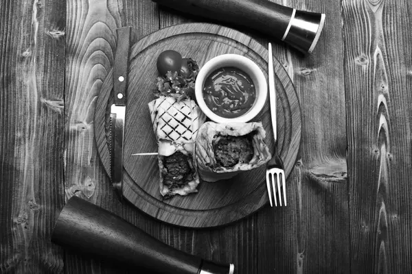 Flatbread with pork or chicken filling and red chili sauce. Traditional cuisine concept. Burrito or tortilla served in restaurant — Stock Photo, Image