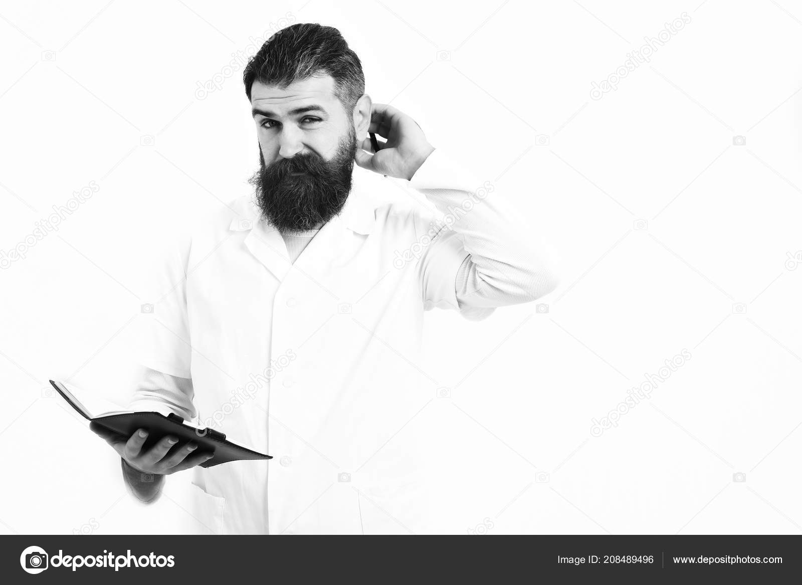 Postgraduate Student Holding Notebook With Pen In Medical Gown