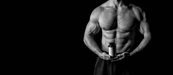 Concept de régime. Bouteille avec des pilules de régime pour la musculation. Vitamine pour une alimentation saine. Muscle building alimentation, espace de copie, noir et blanc — Photo