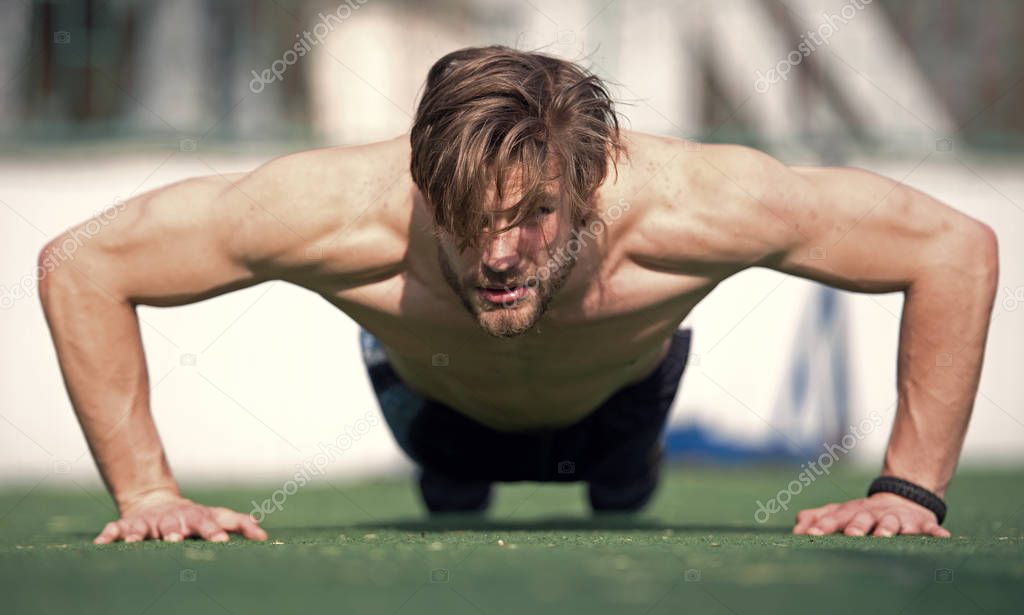 muscular man doing push ups, male athlete exercising push up