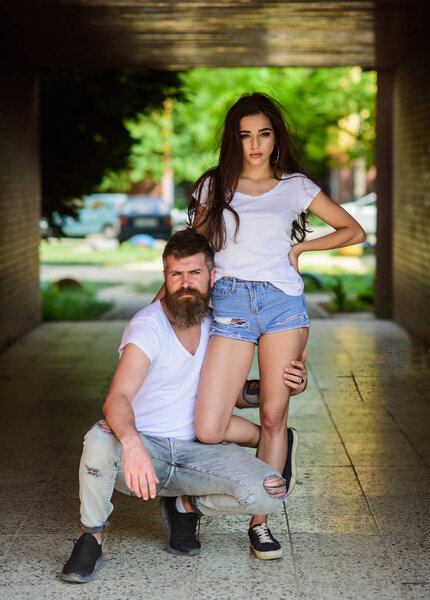 Couple hang out in porch or underground crossing. Underground date. Couple in love cuddling in porch. Girl attractive brunette and bearded hipster man relaxing hang out underground crossing or subway