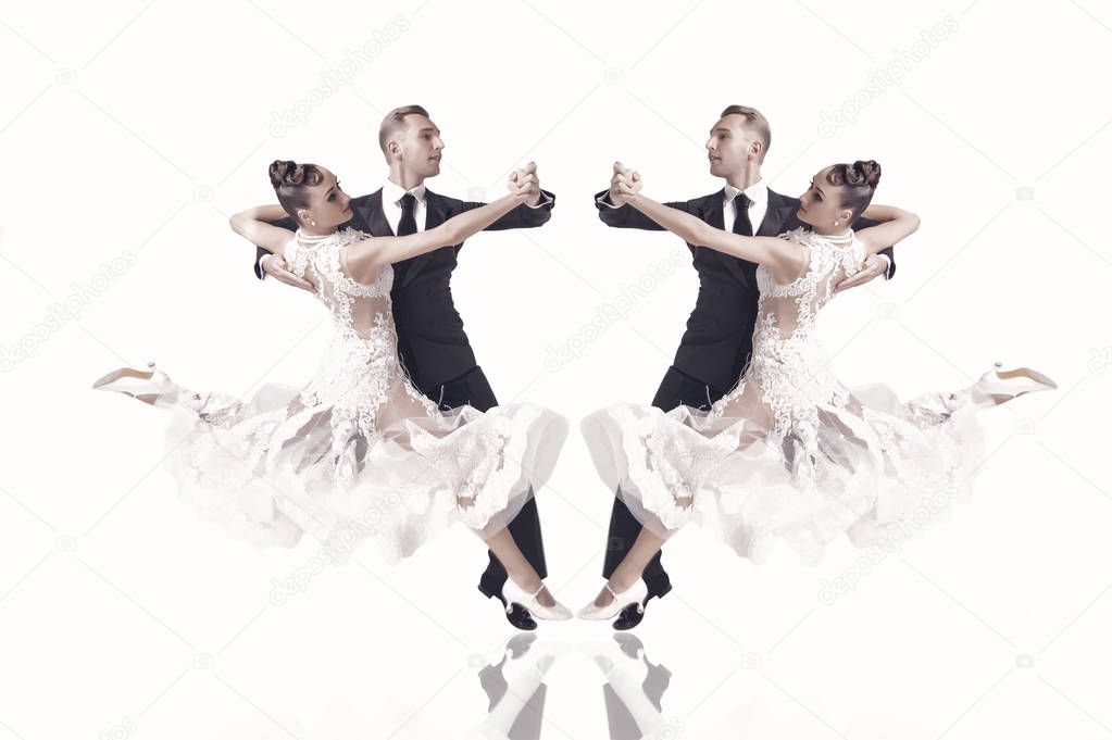 ballrom dance couple in a dance pose isolated on white bachground