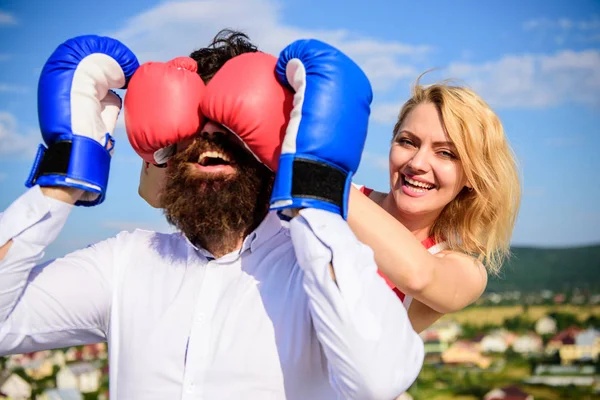 Tricky female. Relations game or struggle. Play and have fun. Tricks every woman needs to know. Girl smiling face covers male face with boxing gloves. Break rules to success. Cunning tricks to win — Stock Photo, Image