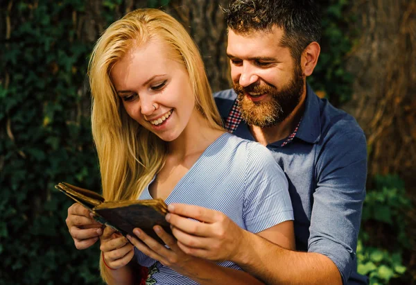 Girl with happy face holds old book. — Stock Photo, Image