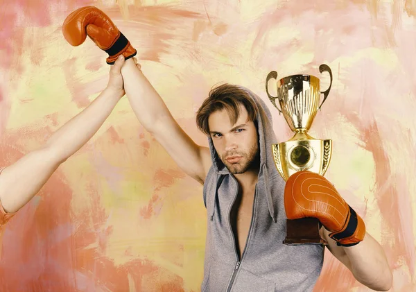 Man with prize on colorful background. Boxer with serious face — Stock Photo, Image