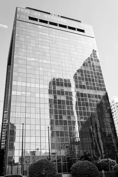 Skyscraper building with glass facade on blue sky. Architecture and design. Commercial property or real estate. Success and future concept — Stock Photo, Image