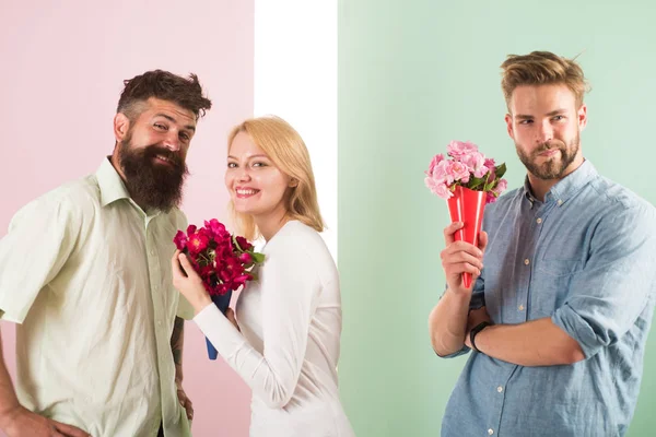 Men competitors with bouquets flowers try conquer girl. Broken heart concept. Girl smiling made her choice. Woman happy takes bouquet flowers romantic gift. Girl popular receive lot male attention — Stock Photo, Image