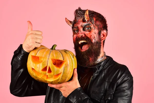 Devil or monster with October decorations. Man wearing scary makeup — Stock Photo, Image