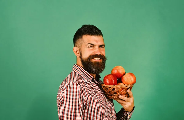 Guy presents homegrown harvest. Farmer with smiling face