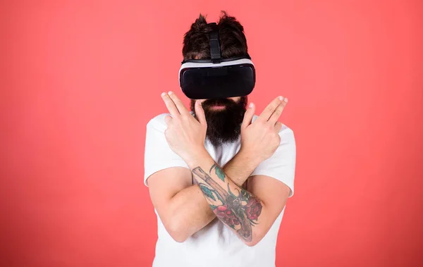 Man bearded hipster with virtual reality headset on red background. Shooting gallery VR. Man hand gesture as gun play shooter game in VR glasses. First person shooter shows how addictive VR could be — Stock Photo, Image
