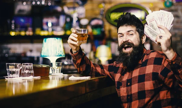 Alcohol drinks concept. Man with drunk face sit alone