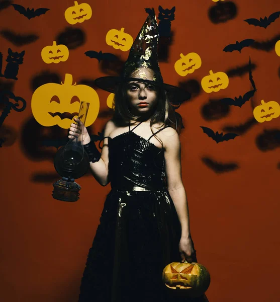 Halloween party and decorations concept. Kid in spooky witches costume — Stock Photo, Image