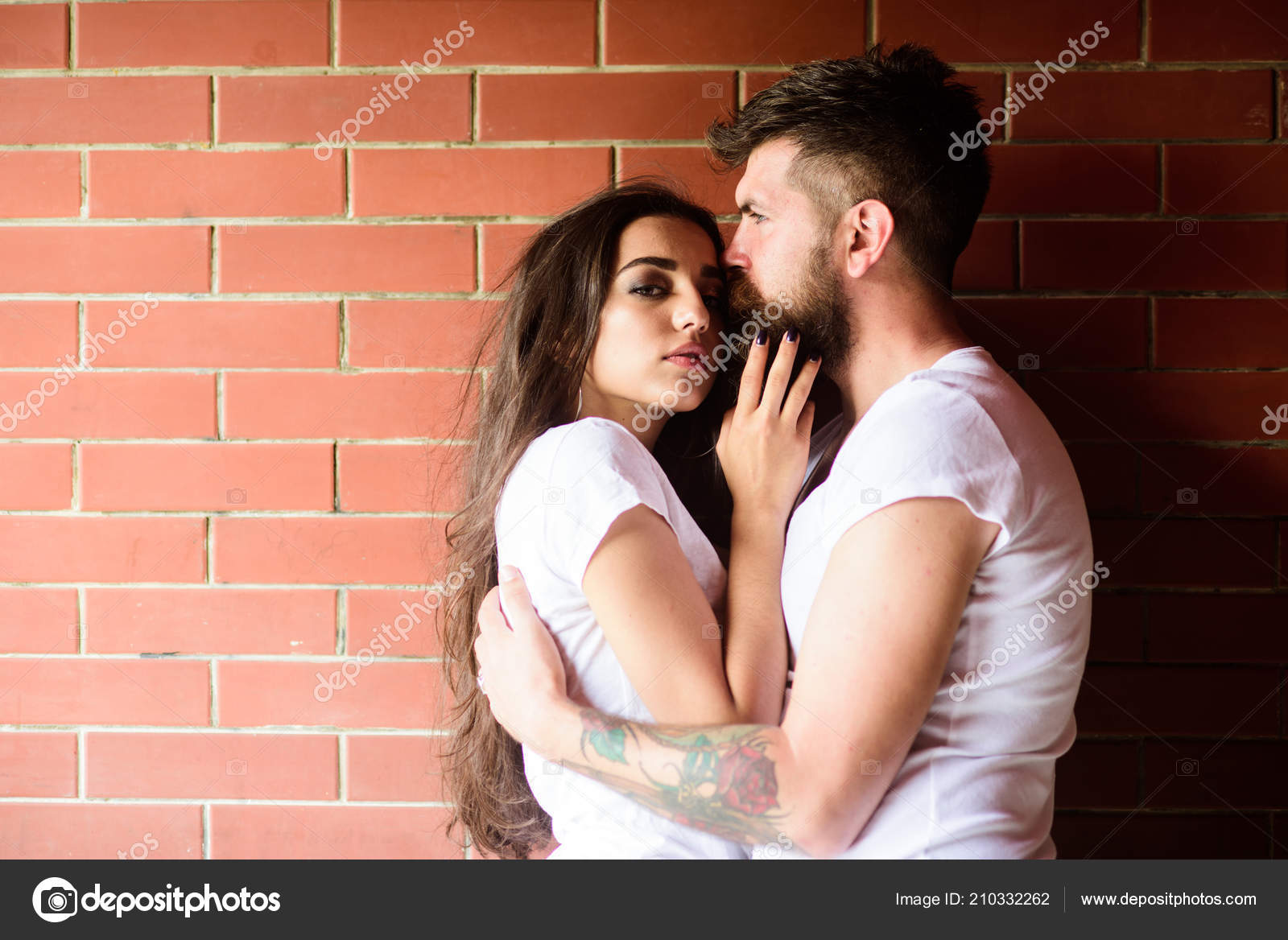 Moments of intimacy. Couple in love hugs brick wall background. Couple find  place to be alone. Girl and hipster romantic date intimacy moment. Couple  enjoy intimacy cuddling without witnesses Stock Photo by ©
