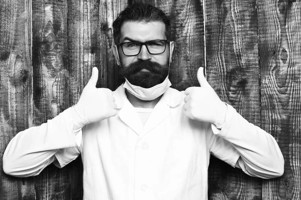 Bearded brutal caucasian doctor or postgraduate student in gloves — Stock Photo, Image