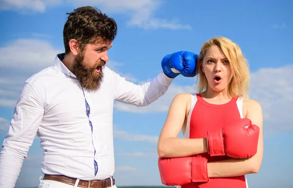 Learn to resist punch. Couple in love boxing gloves sky background. Man punch girl boxing glove. She did not expect be attacked. Prepare for sudden attack. Woman undergoes violence. Stop violence