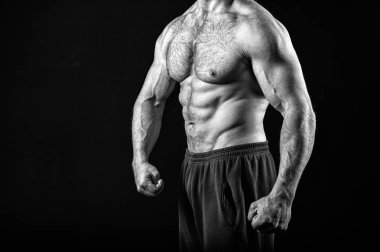 Muscle concept. Muscle torso with six pack abs of man, black and white. strong man isolated on black. clipart