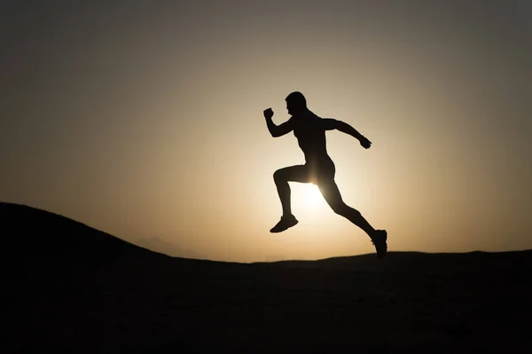 Never stop. Silhouette man motion running in front of sunset sky background. Future success depends on your efforts now. Daily motivation. Healthy lifestyle personal achievements goals and success — Stock Photo, Image