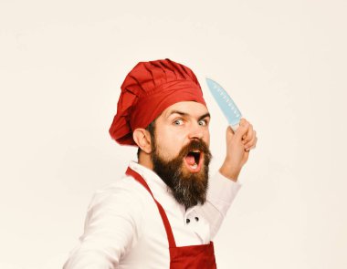 Cook with wild face in burgundy apron and chef hat. clipart