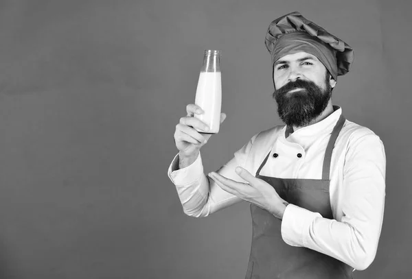 Chef with milkshake or yoghurt. Nutritious lactose concept. — Stock Photo, Image