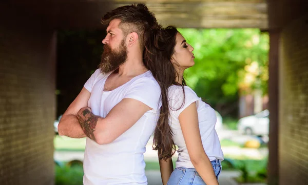 Couple in love can not find same point of view. Girl attractive brunette bearded hipster man stand back to back porch underground crossing. Couple problems relationship. Couple has disagreements.