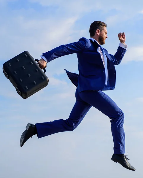 Success in business demands supernatural efforts from entrepreneur personality. Businessman with briefcase jump high motion forward. Businessman formal suit make effort to succeed. Supernatural power