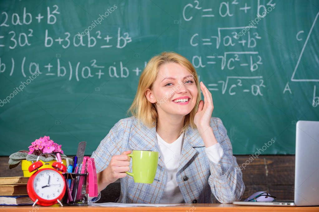 Pleasant relax after classes. Working conditions which prospective teachers must consider. Woman smiling teacher holds mug drink classroom chalkboard background. Working conditions for teachers.