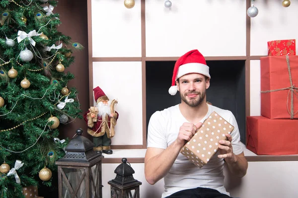 Man with present box at Christmas tree — Stock Photo, Image