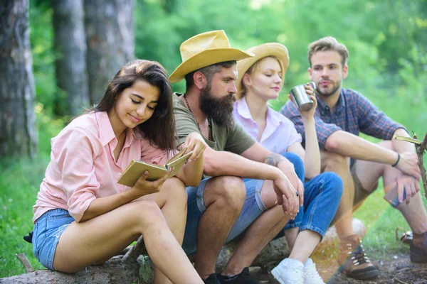 Company friends spend great time picnic or barbecue near bonfire. Idyllic weekend. Group friends spend leisure weekend hike picnic forest nature background. Friends enjoy weekend barbecue in forest