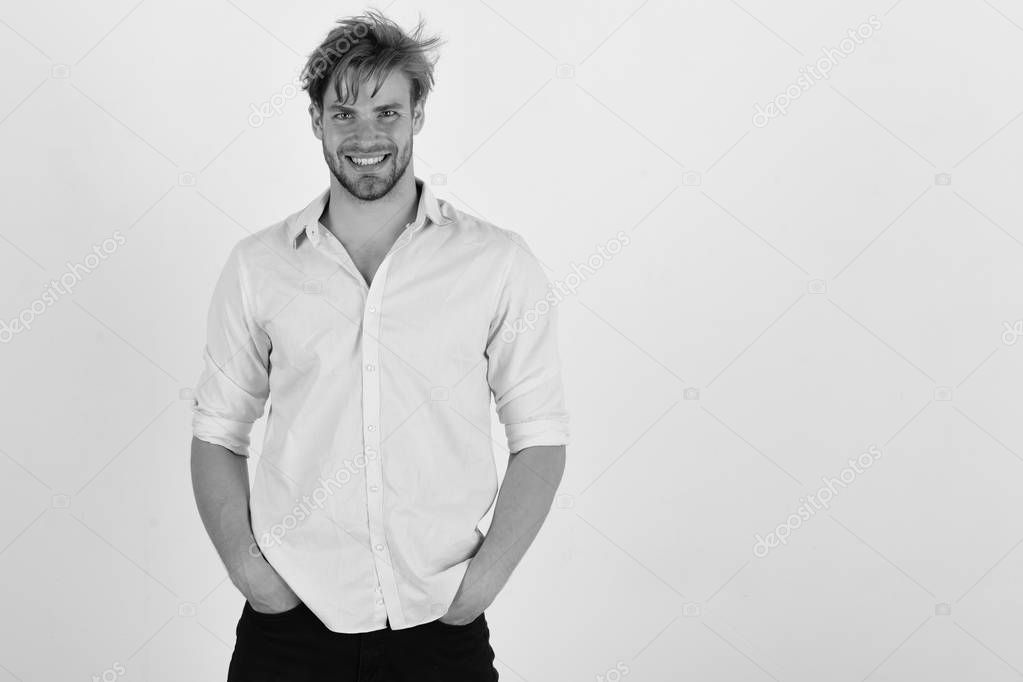 Guy with bristle in pink shirt and messy hair