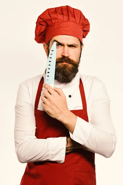 Young bearded man chef in burgundy uniform — Stock Photo, Image