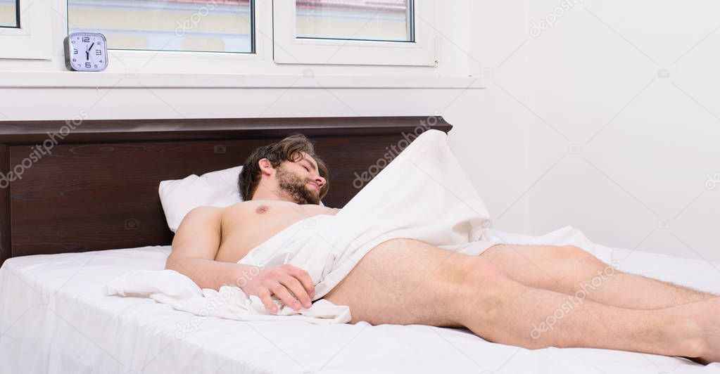 Normal erections occur. Macho sexy guy torso relaxing lay bedroom. Morning wood or formally known nocturnal penile tumescence common occurrence for man. Male health. Why men get morning erections