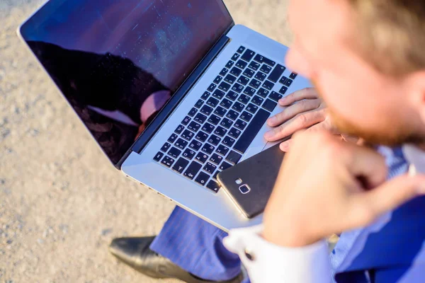 Create useful post for your online community. Working on new post for blog. Blog online communication. Businessman surfing internet or reply emails while sit with laptop outdoors rear view — Stock Photo, Image