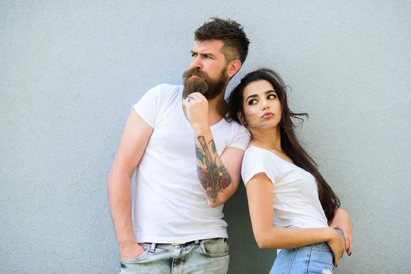 Couple stylish youth. Couple white shirts cuddle each other. Romantic couple. Couple in love hang out together grey wall background. Hipster bearded and stylish girl hang out urban romantic date — Stock Photo, Image