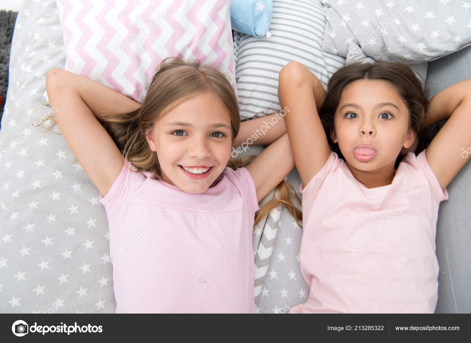 Best Friends Forever Girls Children Lay On Bed With Cute Pillows Top View Pajamas Party Concept Girls In Playful Mood With Grimace Face Friends Children Having Fun Together And Feel Comfortable Royalty