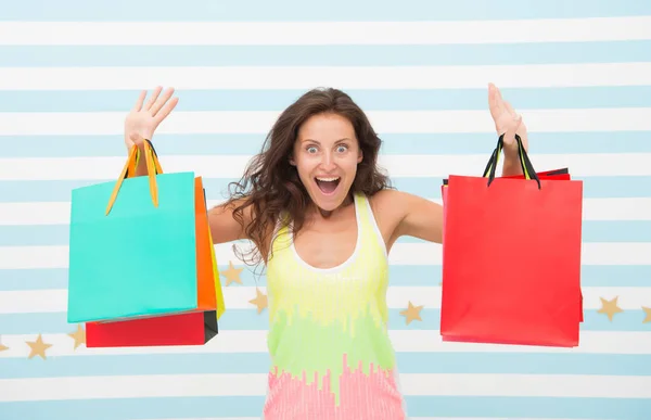 Feel free buy everything you want. Woman carries bunch shopping bags striped background. Finally bought favorite brand. Tips shop sales. Girl satisfied with shopping. Profitable purchase black friday — Stock Photo, Image