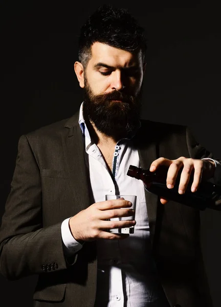 Sommelier with beard tasting alcohol. Businessman with serious face — Stock Photo, Image