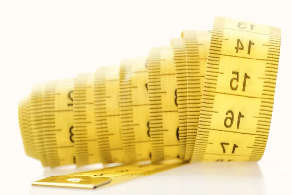 The Measuring Tape of Yellow Color with Numerical Indicators in