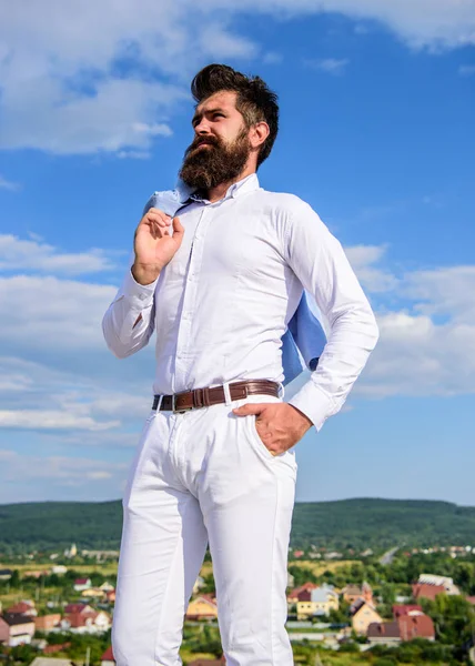 Real man style. Hipster beard and mustache looks attractive white shirt. Guy enjoy top achievement. Man bearded hipster formal clothes feels proud of himself sky background. Superiority and power
