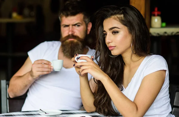 Morning coffee tradition. Couple enjoy hot espresso. Having black cup of coffee when feel tensed or low can boost your mood instantly make things better. Couple drink black espresso coffee in cafe