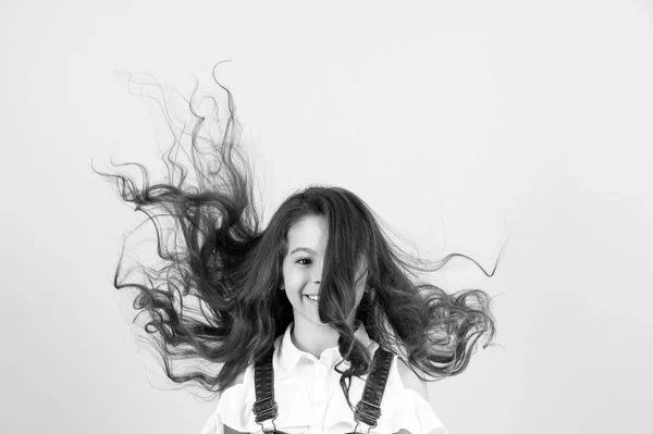 Hair style, care concept. black and white happy little girl