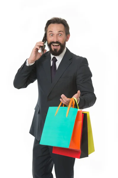 Man make internet purchases using smartphone. Man with paper bags. Buy and sell online. Doing business online is so easy. Enjoy surfing net for business and shopping — Stock Photo, Image