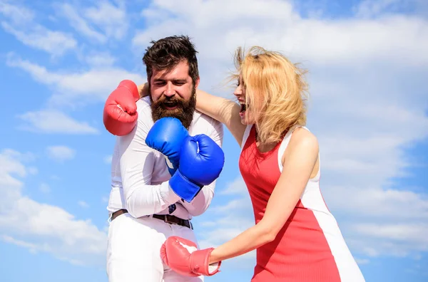 Attack is best defence. Defend your opinion in confrontation. Female attack. Relations family life as everyday struggle. Man and woman fight boxing gloves sky background. Couple in love fighting