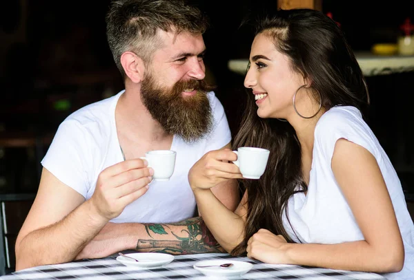 Pleasant coffee break. Couple in love drink black espresso coffee in cafe. Couple enjoy hot espresso. Romantic date in cafe. Drinking black coffee improves your mood and thus makes you happy