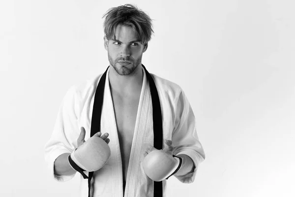 Sports and combat concept. Guy poses in white kimono — Stock Photo, Image