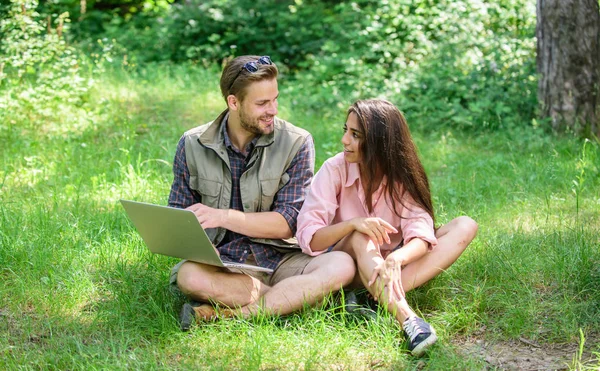 Nature best workspace. Modern technologies give opportunity to be online and work in any environment conditions. Man and girl looking at laptop screen. Couple youth spend leisure outdoors with laptop