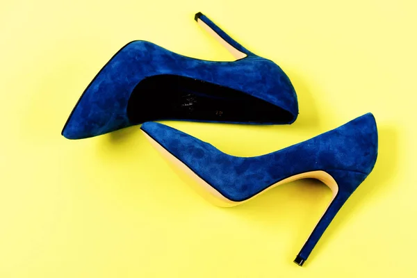 Pair of blue suede high heel shoes