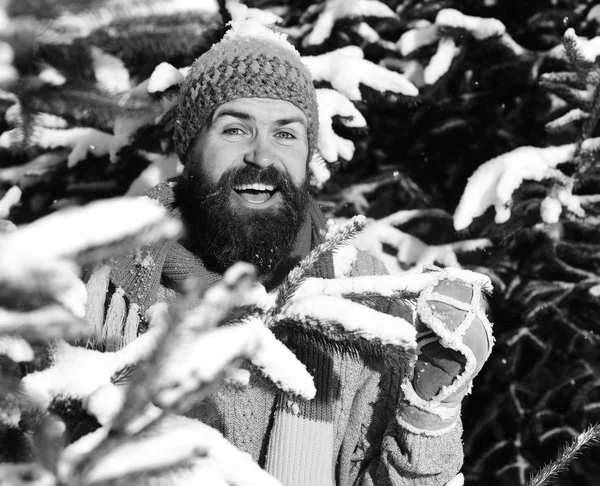 Guy with happy face with nature covered with snow