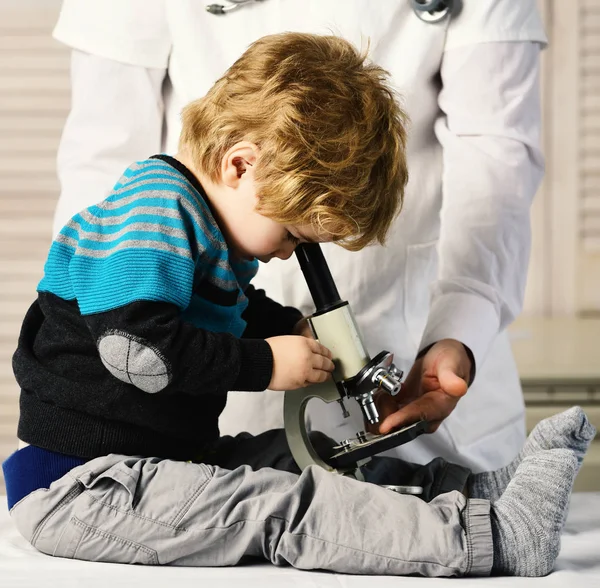 Man and kid with busy face playing doctor or scientist. — Stock Photo, Image